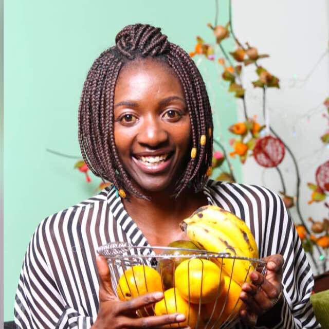 Health coaching expert holding a basket of fruits